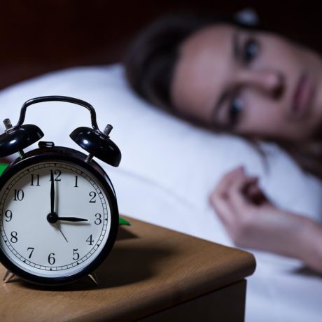 alarm clock on a bedside table