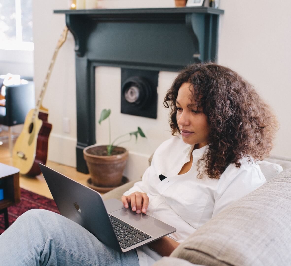 Woman looking at her laptop and smiling