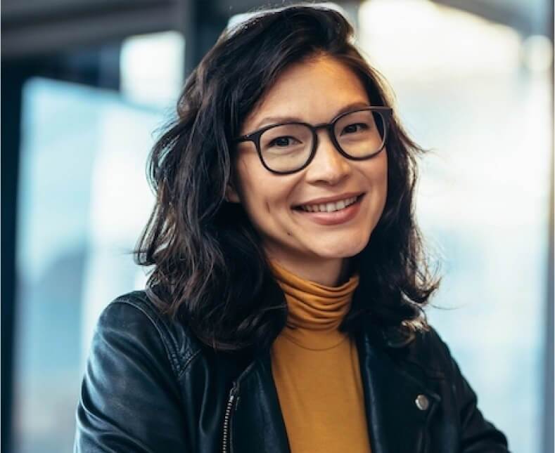 woman looking at camera and smiling