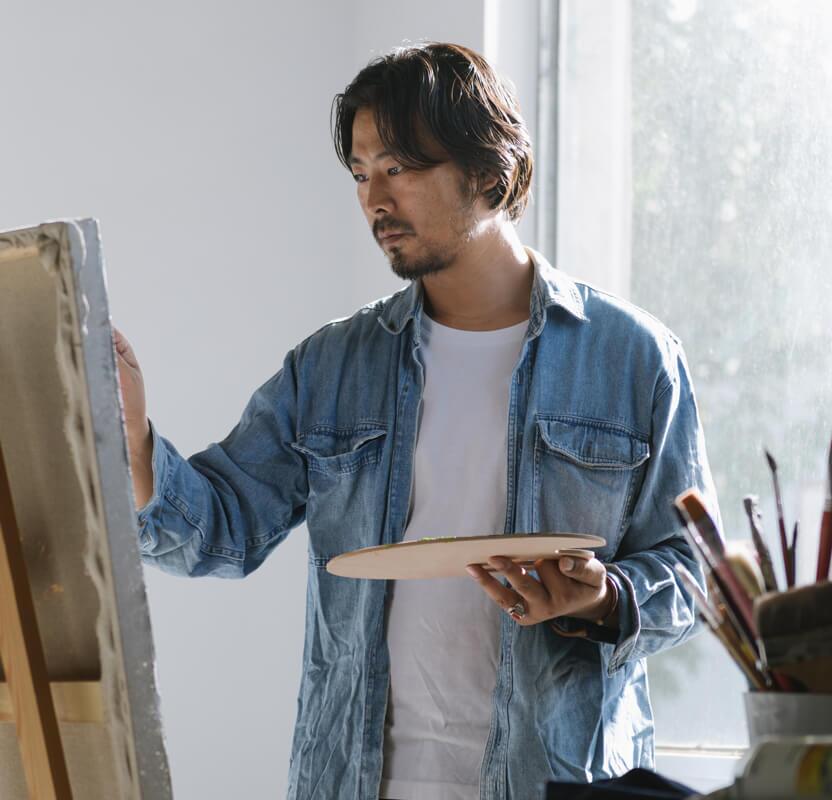 Man painting on a canvas