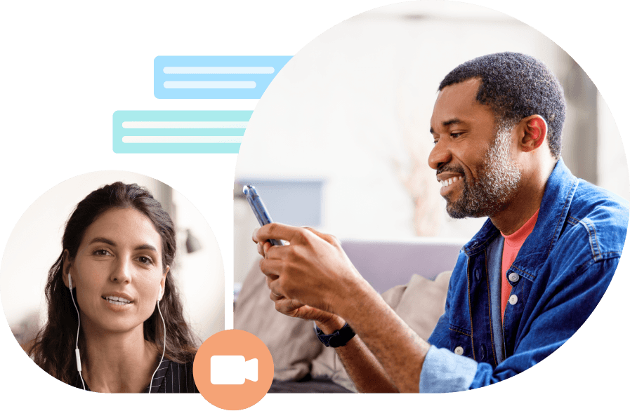 man smiling and looking at cell phone