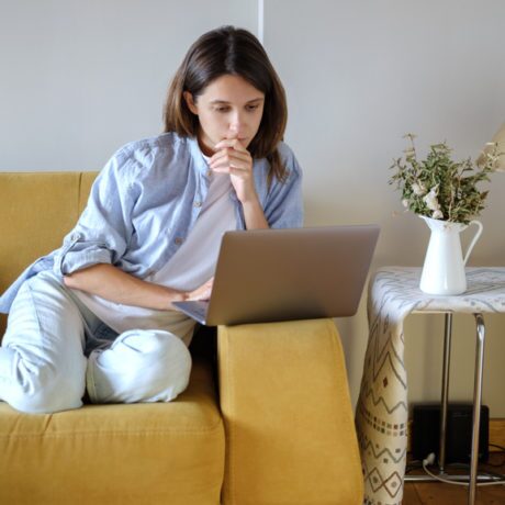 woman sitting on a couch looking at kaotop